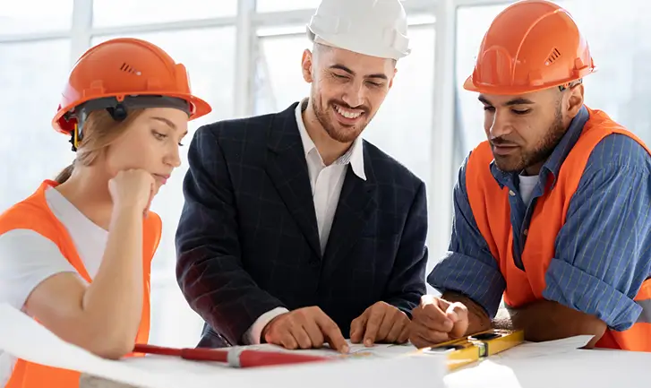 Professionals reviewing blueprints